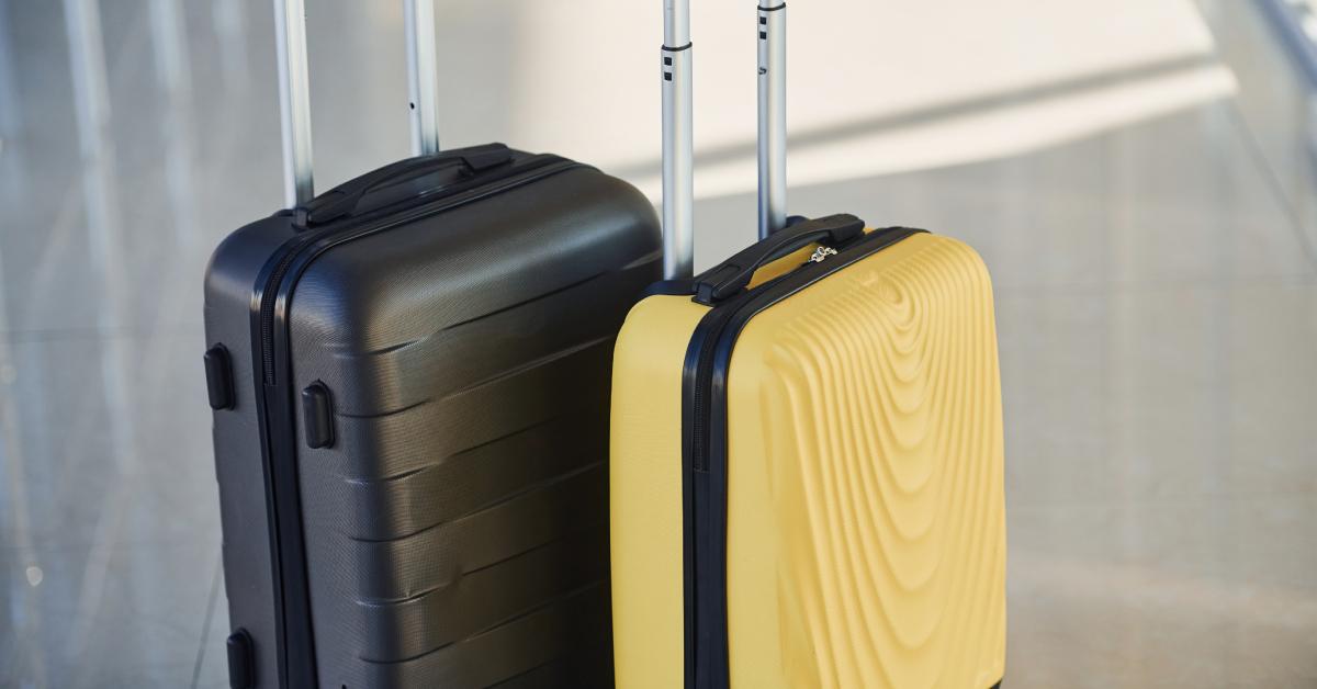 Black and yellow suitcases in an airport.