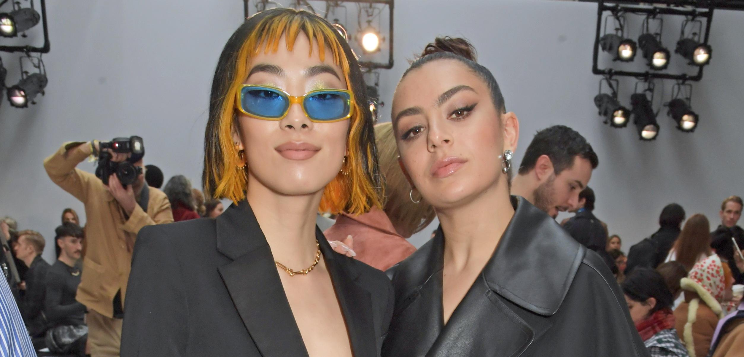 Rina Sawayama and Charli XCX attend the JW Anderson show during London Fashion Week