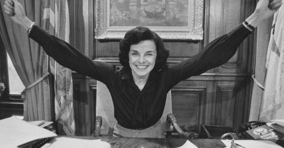 Dianne Feinstein, her arms outstretched in celebration, in her office after she was elected mayor of San Francisco, at San Francisco City Hall in San Francisco, California, circa 1978.