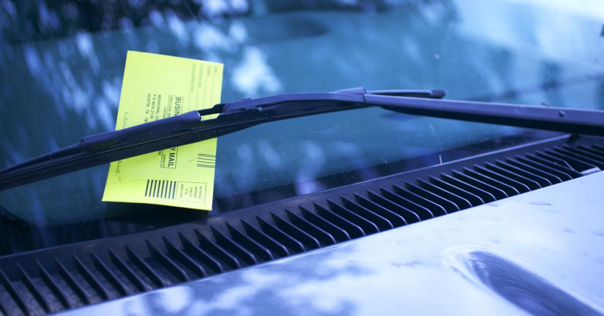 A ticket on someone's car windshield.