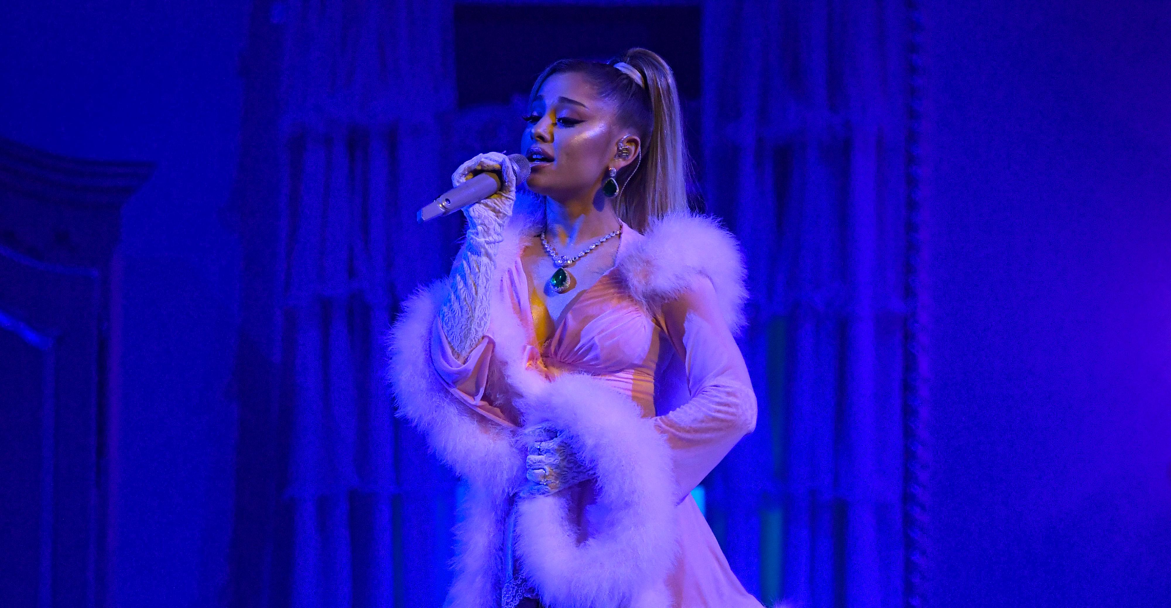 Ariana Grande makes sure to wear an earpiece during her 2020 Grammy Awards performance.